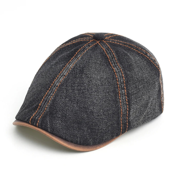 Men's denim flat cap styled to show its classic curved shape