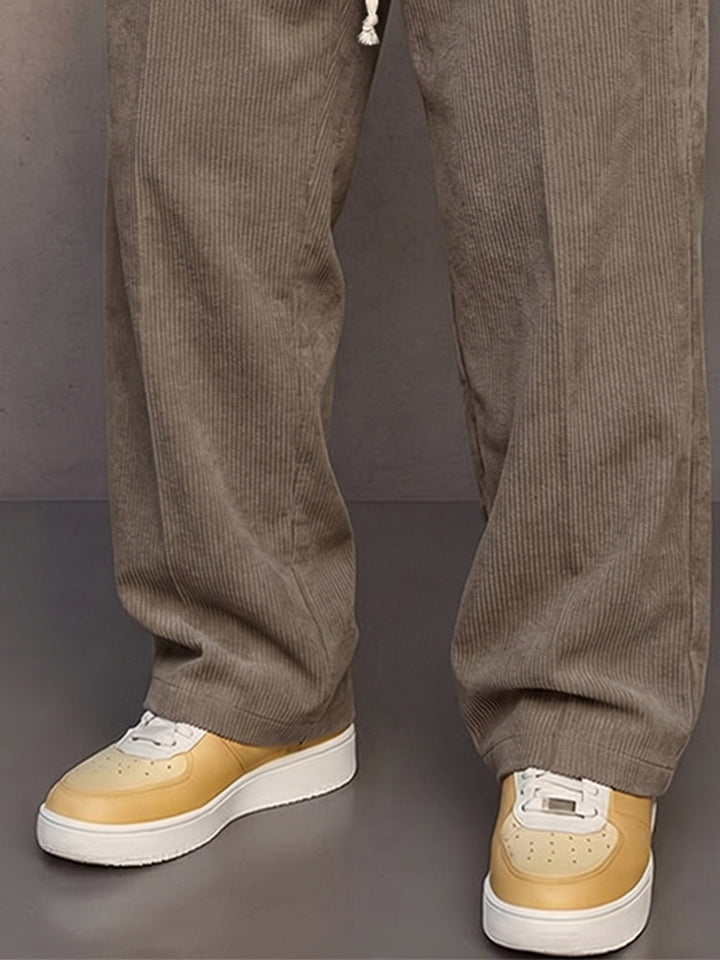 Full view of men's drawstring corduroy trousers for everyday wear