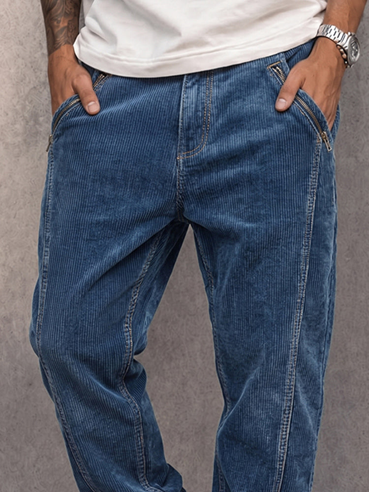 Close-up of the corduroy texture on men's straight-leg trousers