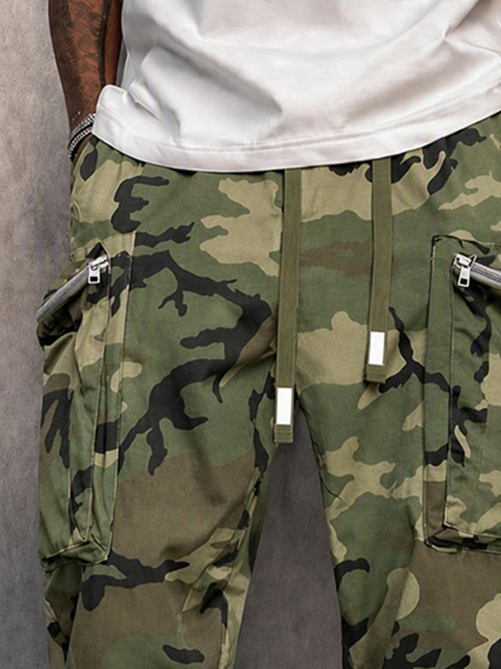 Full-length view of men’s camouflage cargo trousers styled for everyday wear