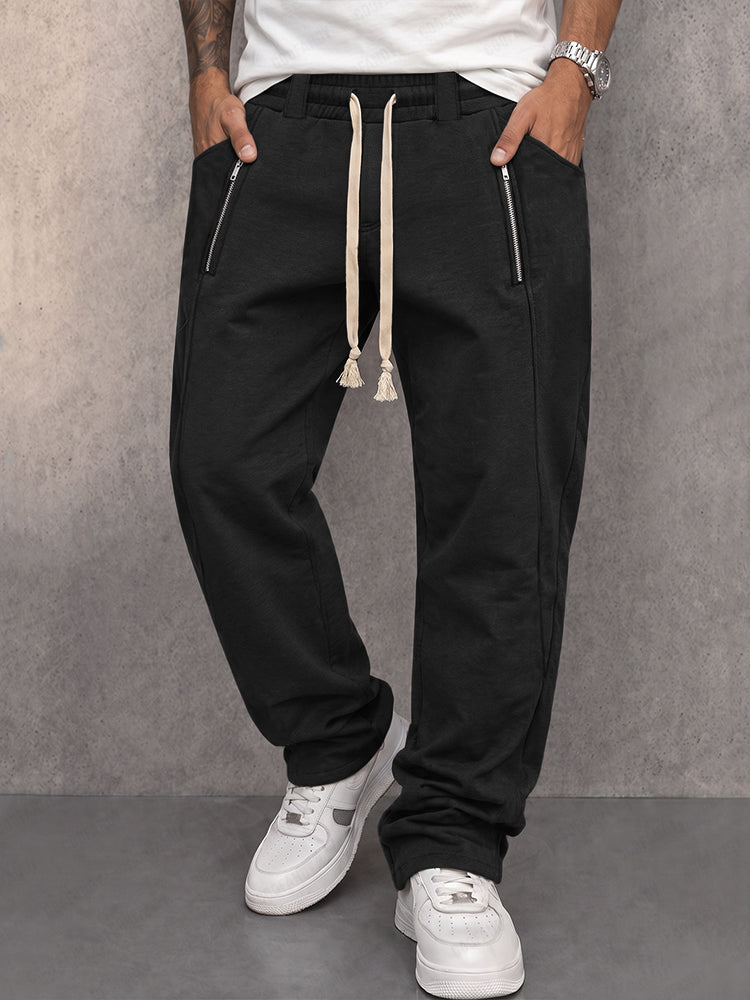 Men's athleisure jogger trousers with zipped pockets shown from the front