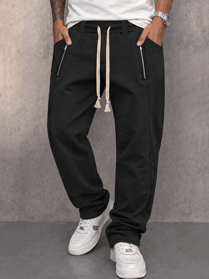 Men's athleisure jogger trousers with zipped pockets shown from the front