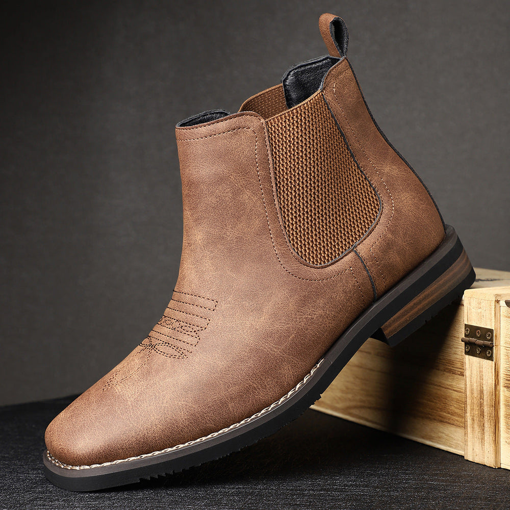 Men’s leather boots displayed at a three-quarter angle