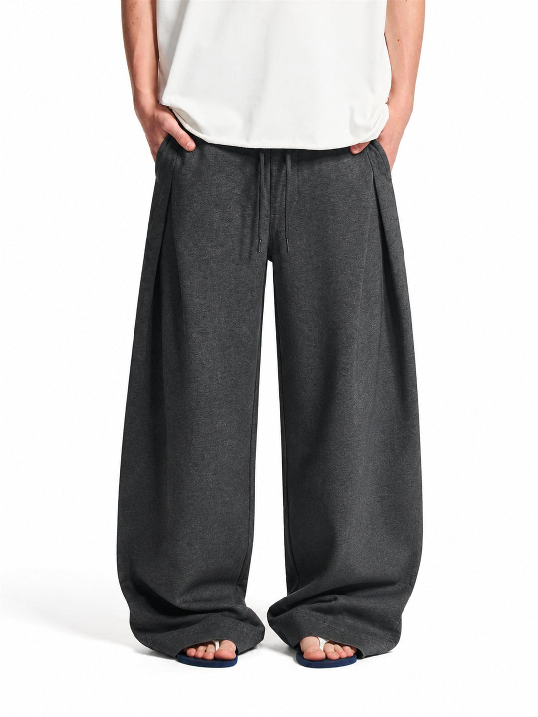 Men's pleated baggy joggers showing the relaxed, roomy fit