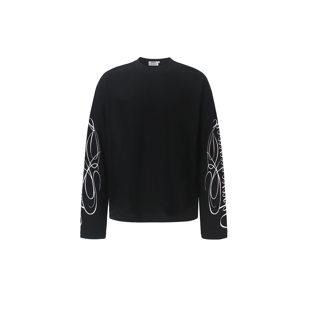 Close-up of the embroidered leopard print detail on the sweatshirt