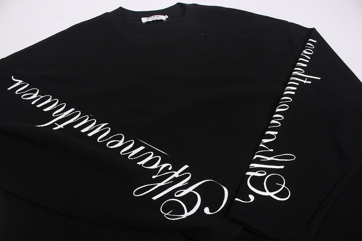Close-up view of the sweatshirt fabric and leopard print embroidery