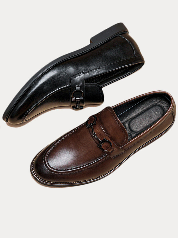 Angled view of men's leather horsebit loafers with polished finish