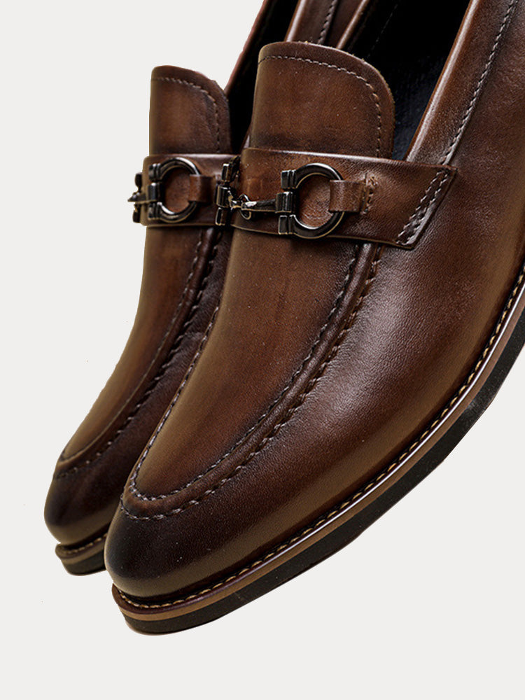 Close-up of horsebit trim on men's top grain leather loafers