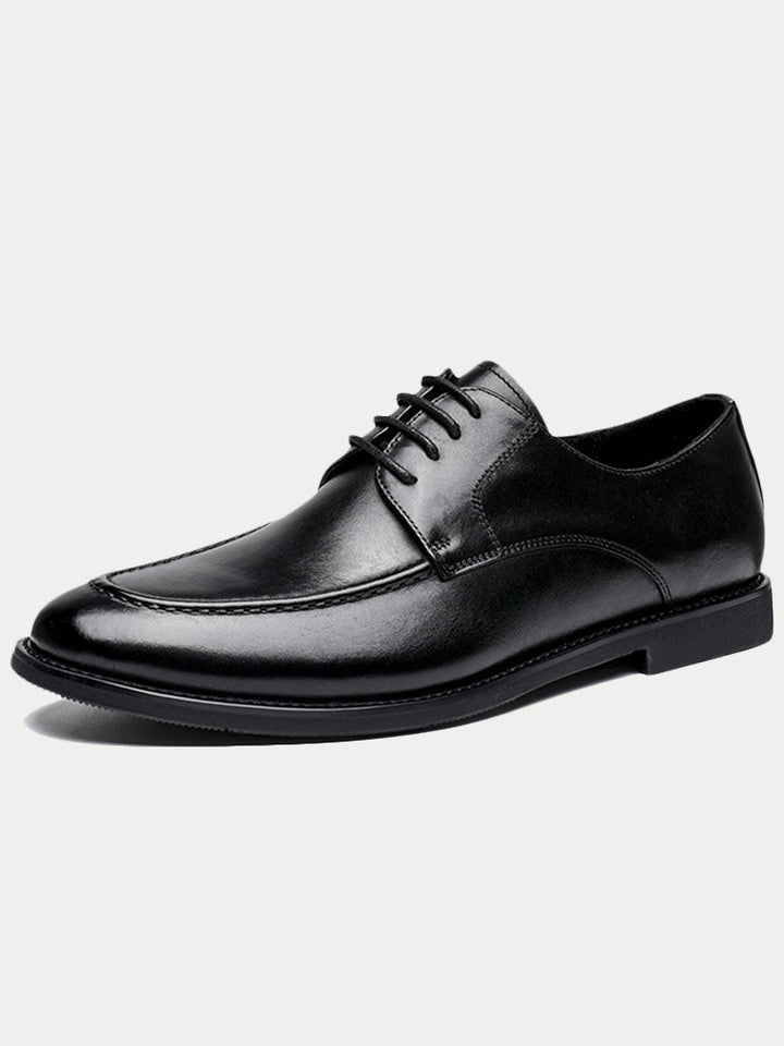 Men's formal leather loafers with horsebit detail from the side