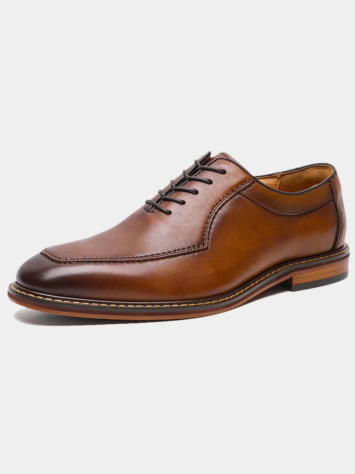 Men's polished leather derby shoes in a formal vintage-inspired style, front angled view