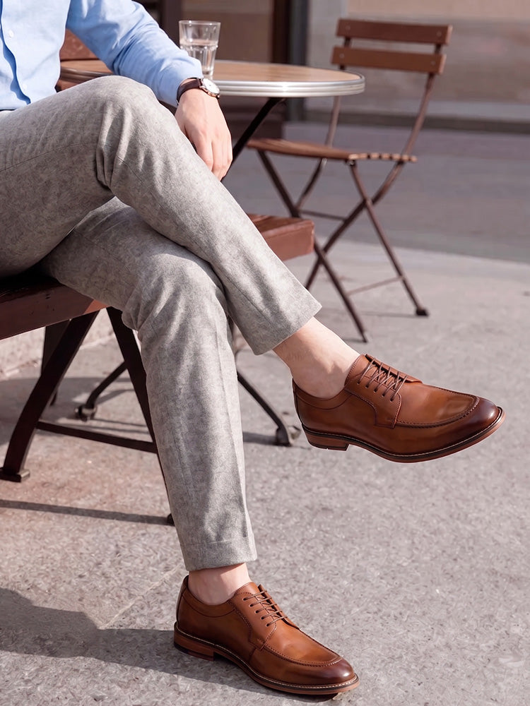 Close-up of polished leather upper on men's formal derby shoes