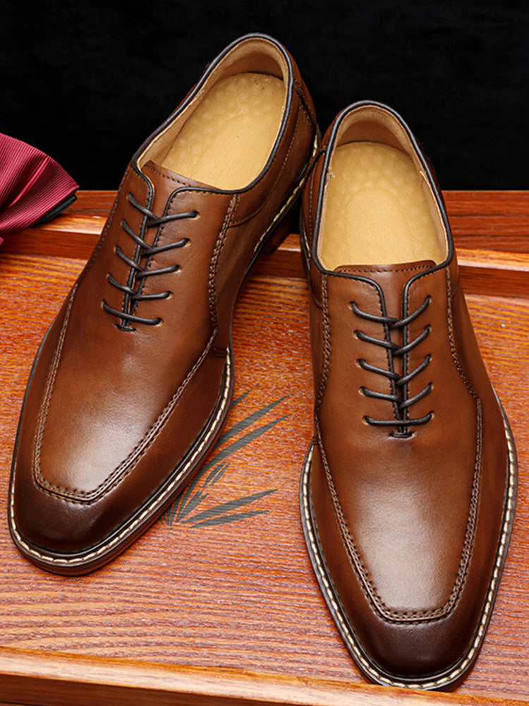 Side view of men's formal leather derby shoes with classic open lacing