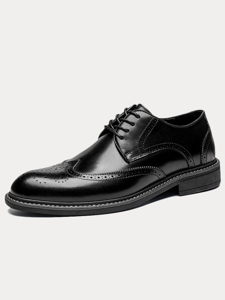 Pair of men's leather brogue derby shoes with classic perforated detailing