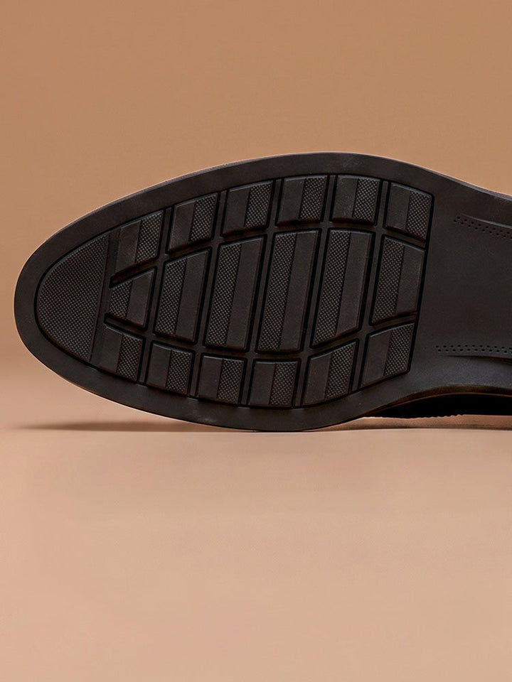 Top view of men's leather brogue derby shoes showing wingtip pattern