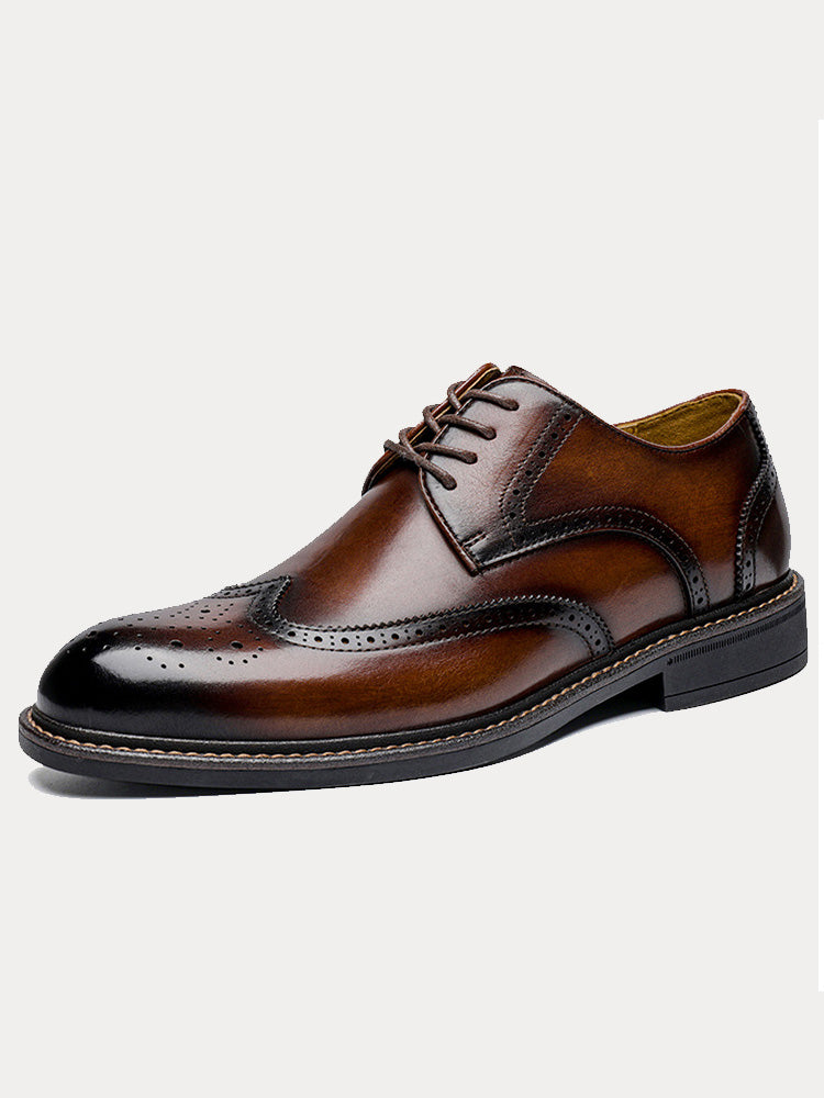 Men's leather brogue derby shoes in wingtip design, angled front view