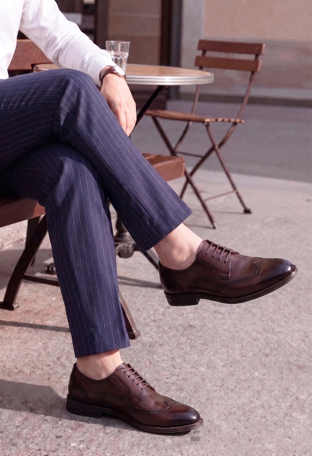 Detailed view of men's wingtip leather brogue shoes with polished finish