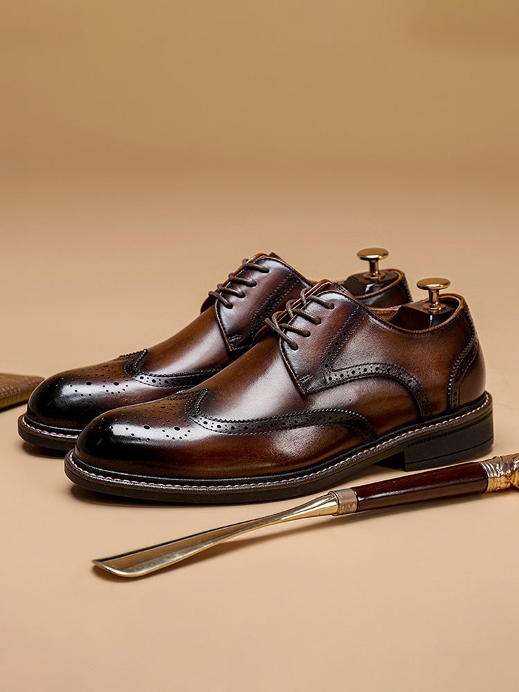 Men's classic leather brogue derby shoes displayed as a pair on white background