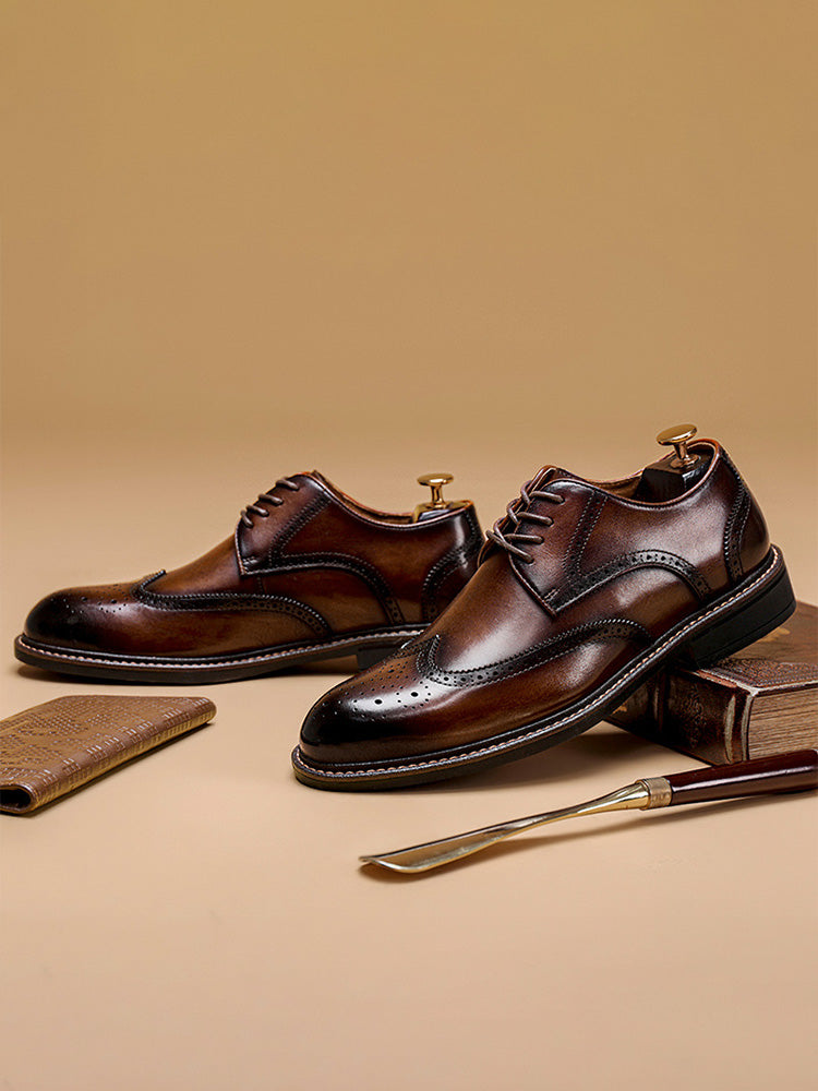 Close-up of brogue perforations on men's leather derby shoes