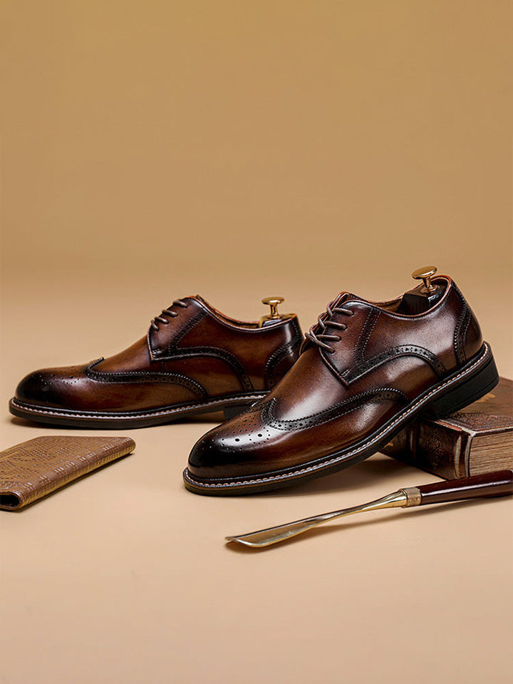 Close-up of brogue perforations on men's leather derby shoes