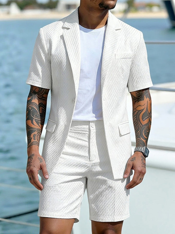 Close-up of the textured fabric on the men's blazer and shorts set