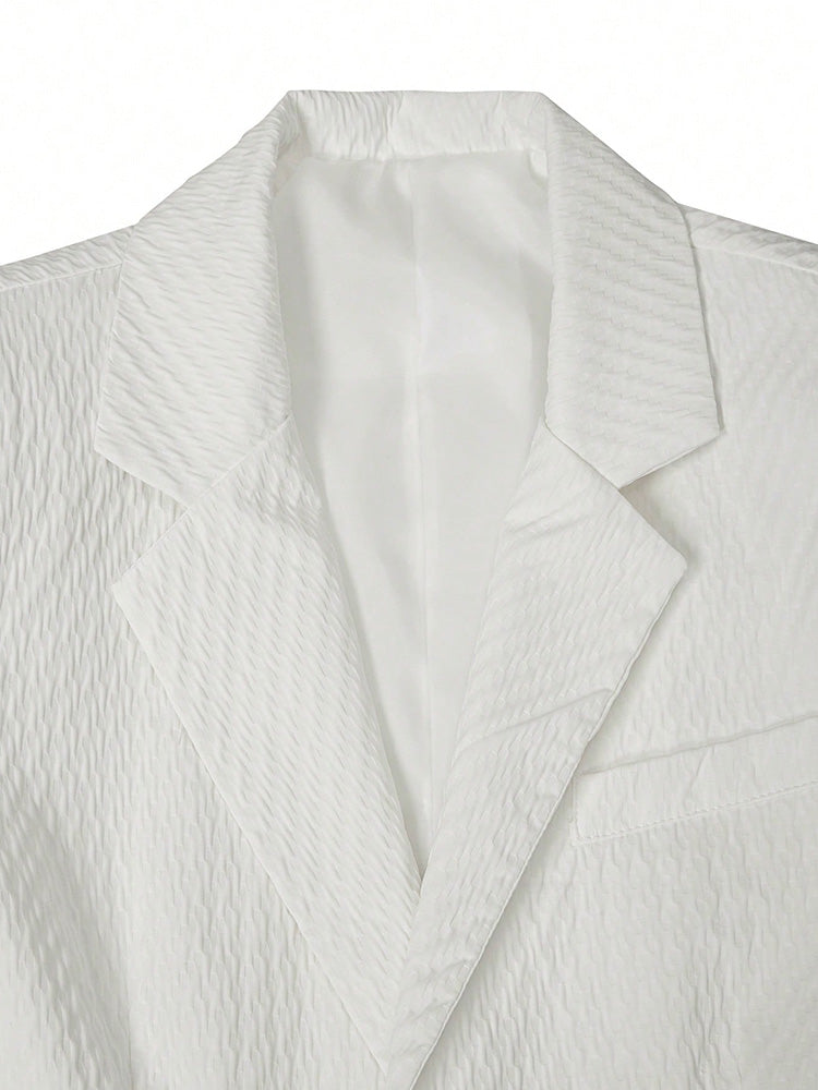 Men's textured blazer worn with matching shorts for a summer smart casual look