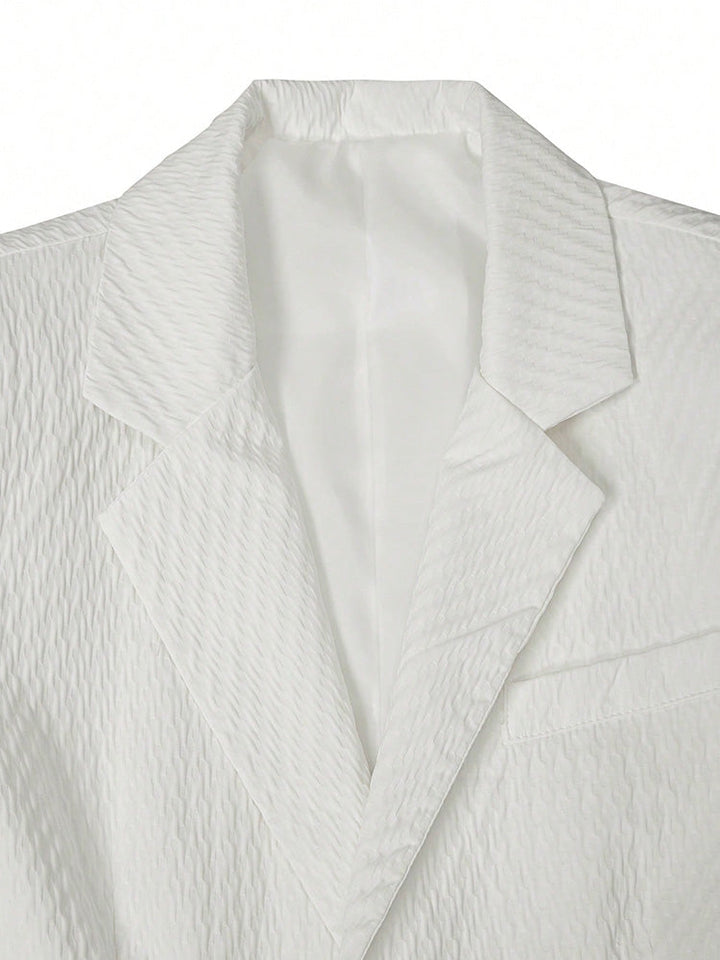 Men's textured blazer worn with matching shorts for a summer smart casual look