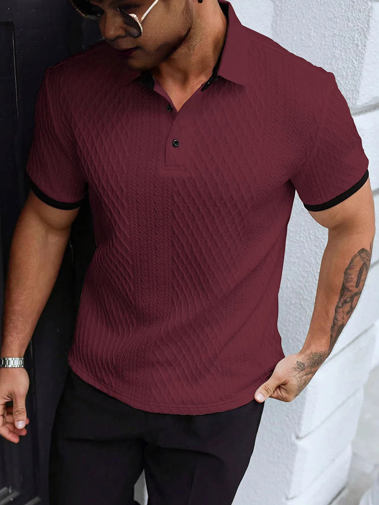 Close-up of jacquard knit texture on the men's white polo shirt