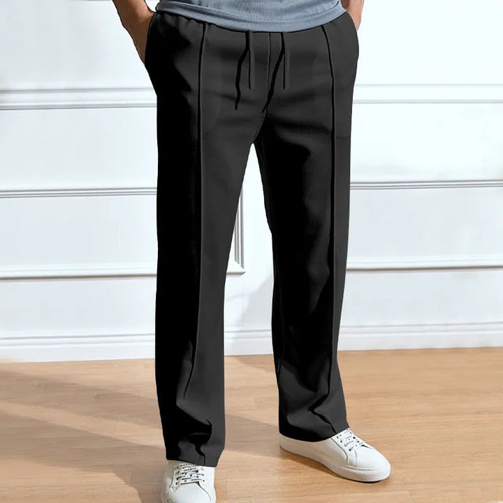 Close-up of the flexible fabric and waistband on men's trousers