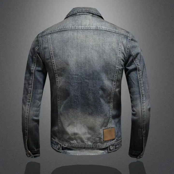 Close-up of the denim jacket collar, buttons and textured fabric