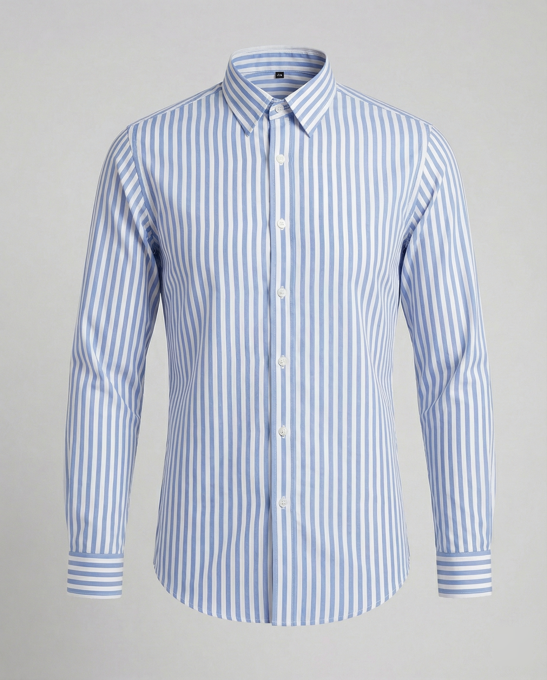 Close-up of striped cotton blend fabric and button fastening