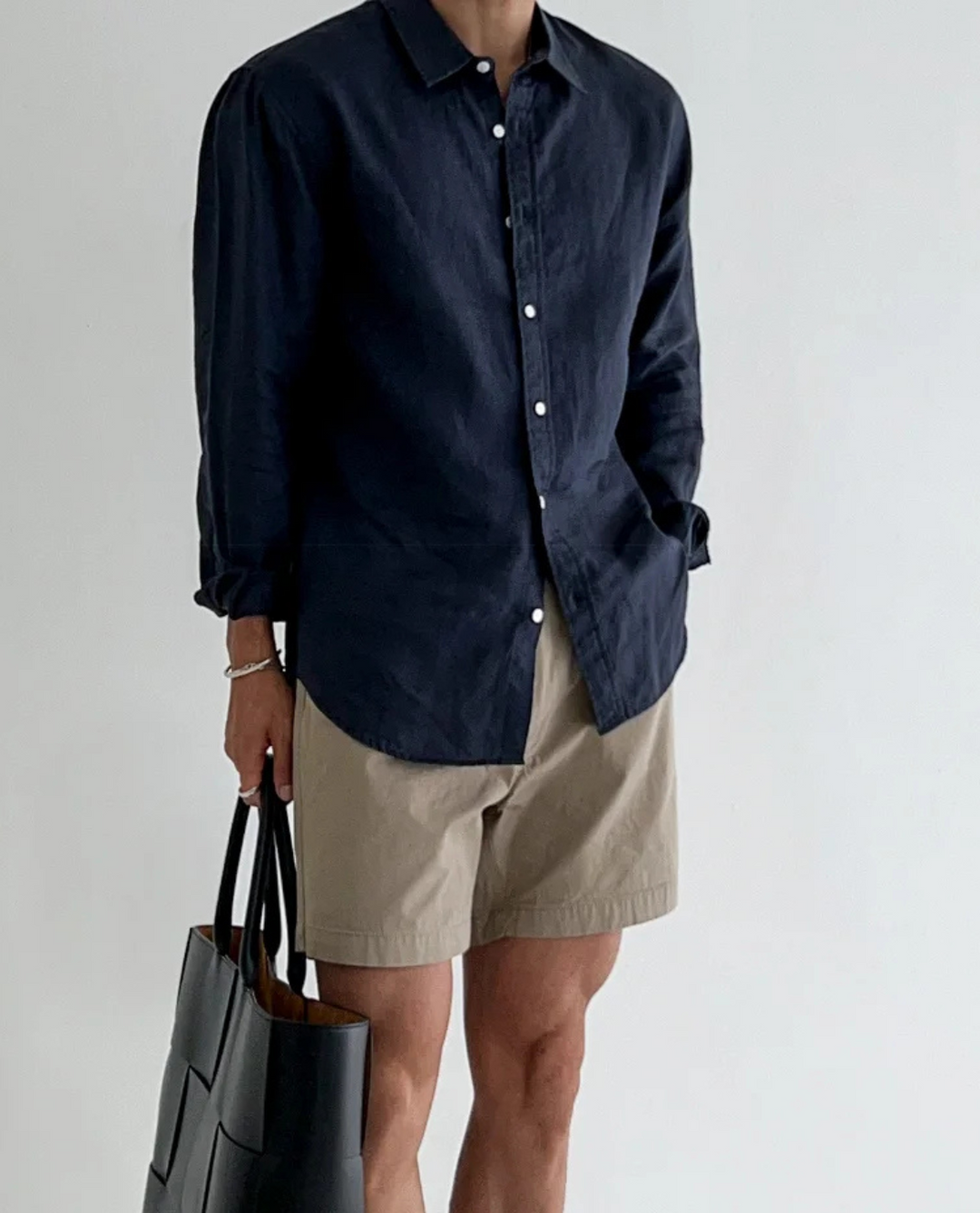 Men's summer linen shirt with short sleeves on a plain background