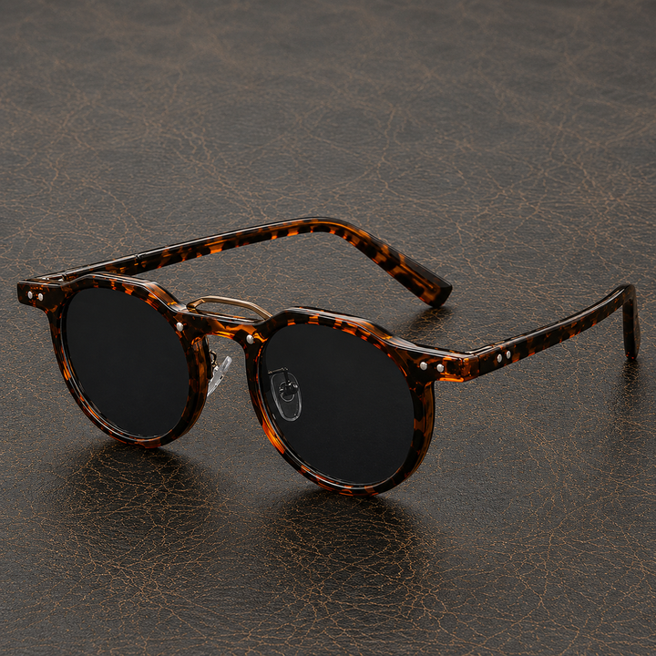 Men's premium round sunglasses with slim temples, angled view