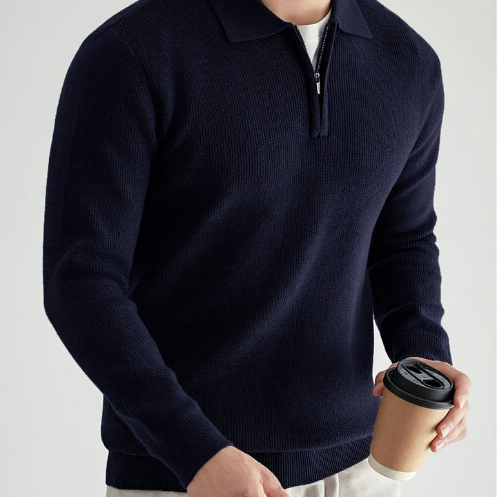 Detail of the hem and knit finish on a men's polo jumper