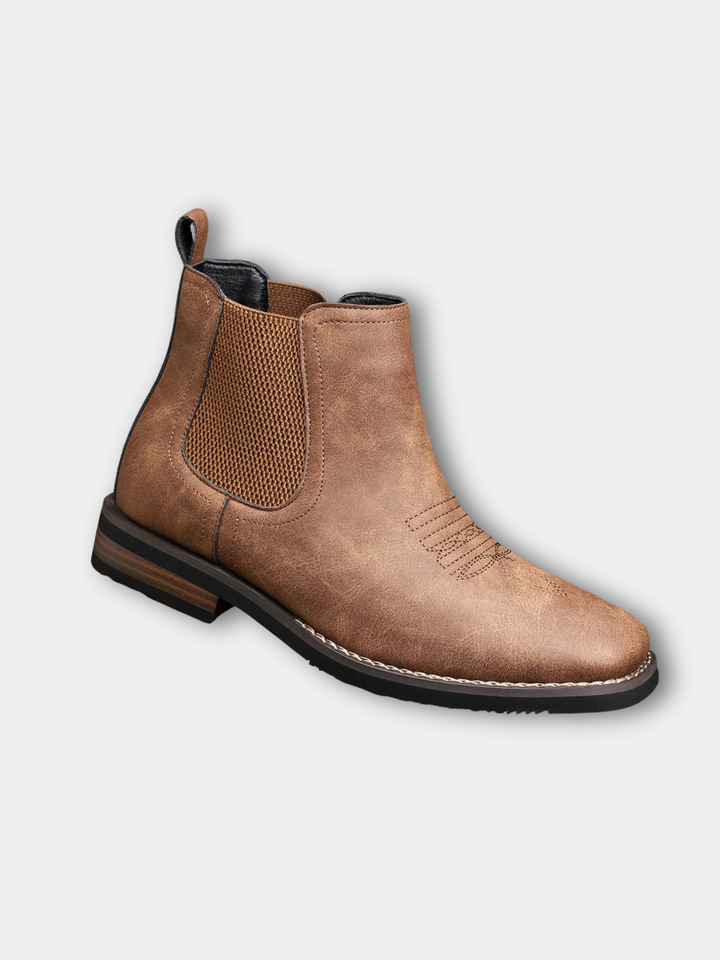 Pair of men’s classic leather boots shown from the front