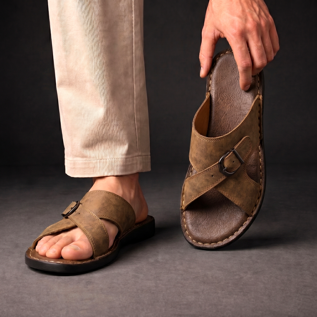 Close-up of adjustable buckle detail on men's criss-cross sandals