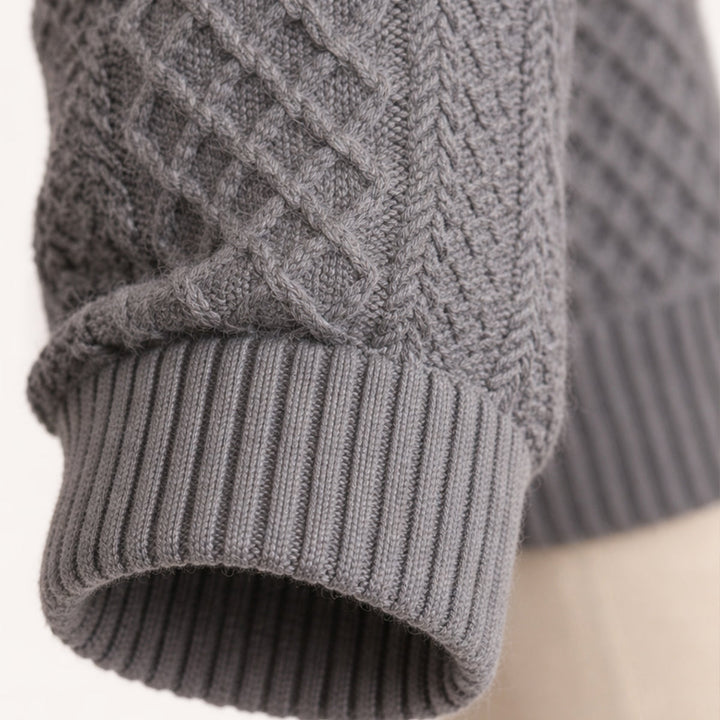 Side view of a men's cable-knit cardigan with long sleeves