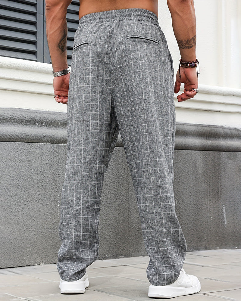 Close-up of the plaid fabric and drawstring waist on men's trousers