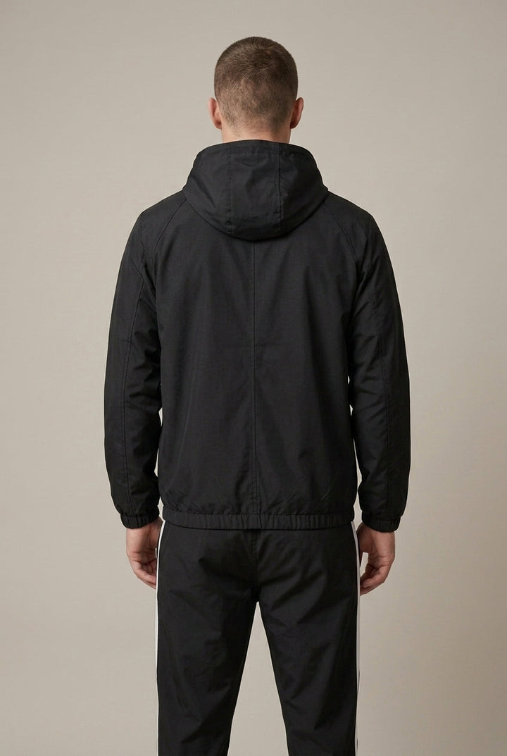 Close-up of the hood and contrast panels on a men's track jacket