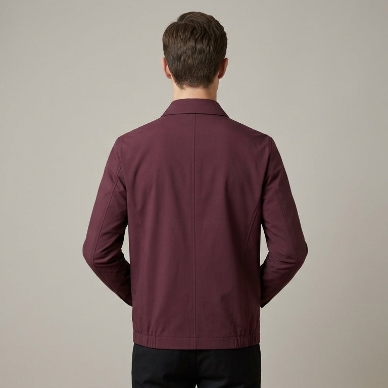 Close-up of the men's jacket collar and upper zip detail