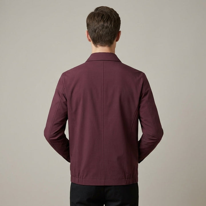 Close-up of the men's jacket collar and upper zip detail