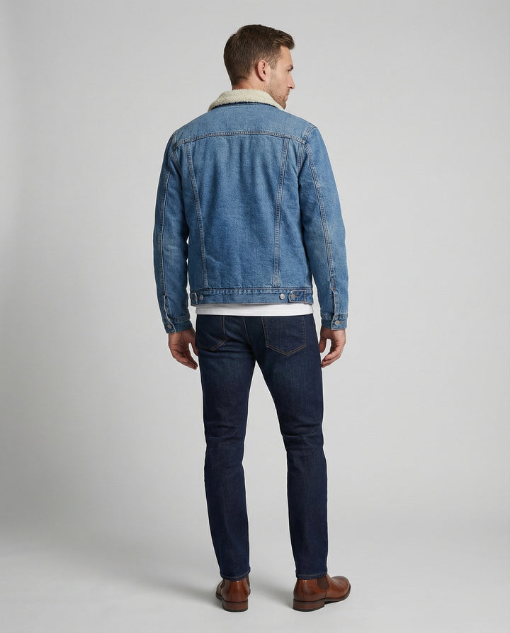Close-up of the denim fabric and front fastening on the jacket