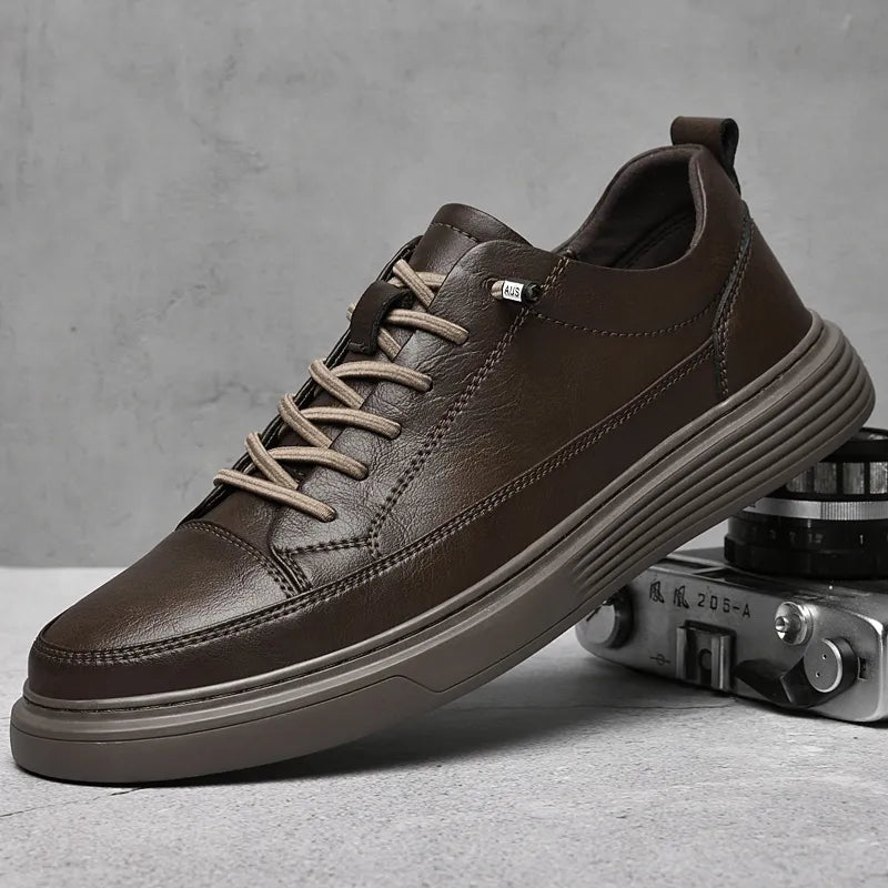 Front view of men's white leather sneakers with lace-up fastening