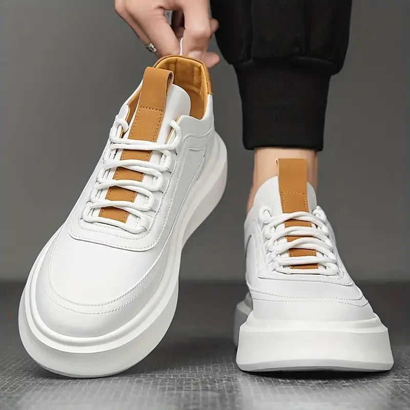 Men's leather trainers displayed at a three-quarter angle