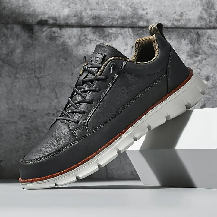 Men's everyday sneakers displayed in a clean product view