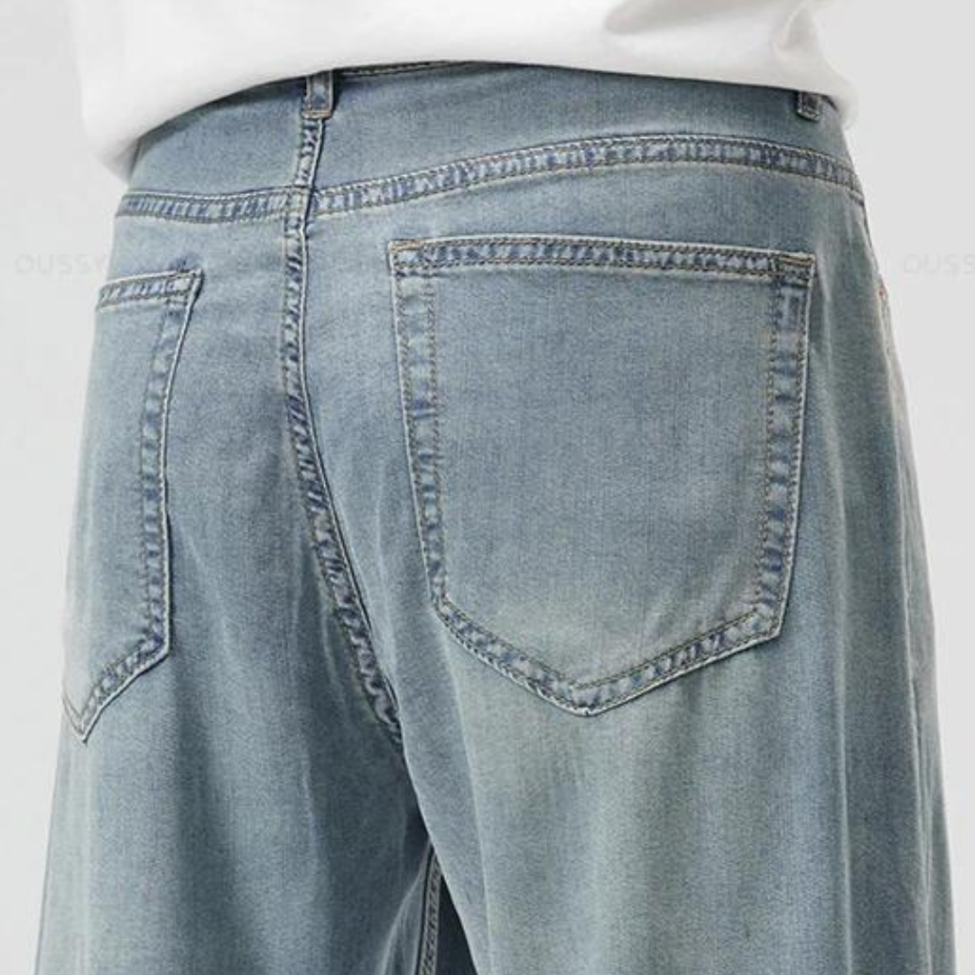 Close-up of stitching and pocket detail on men's lyocell blend trousers
