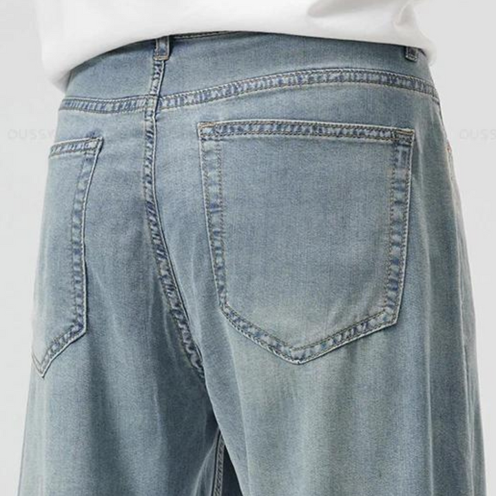 Close-up of stitching and pocket detail on men's lyocell blend trousers