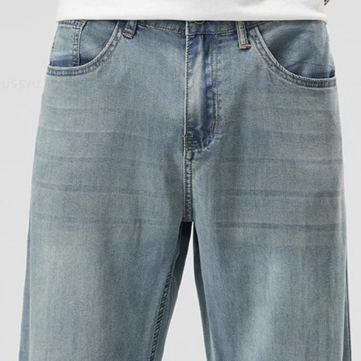 Men's straight-leg lyocell blend trousers shown from the side