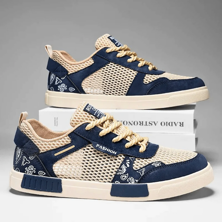 Pair of men's casual mesh trainers with low top design and lace-up closure