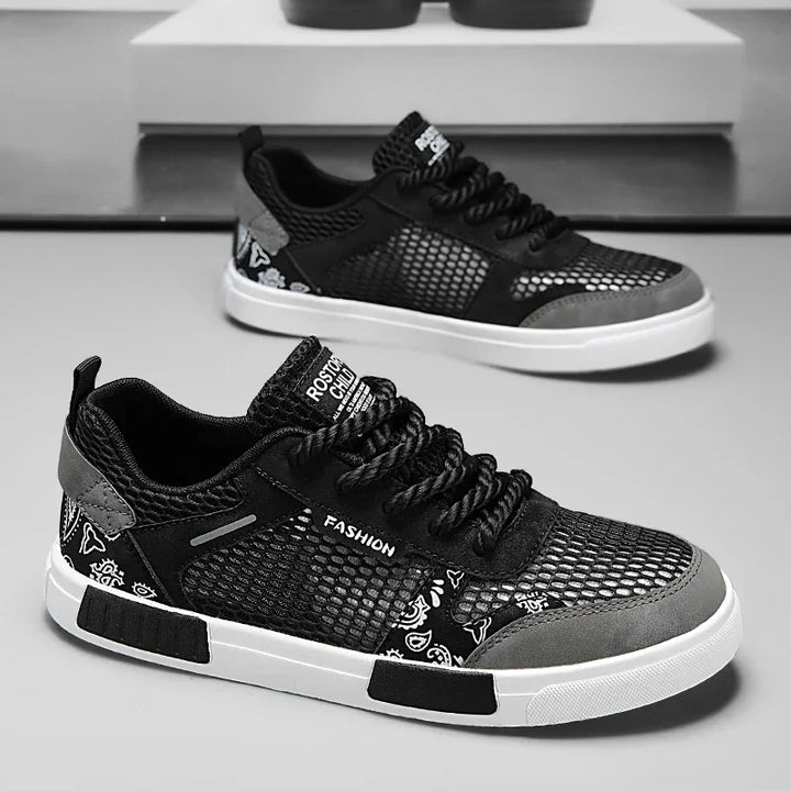 Close-up of men's casual low top trainers highlighting mesh upper and sole texture