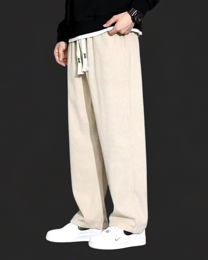 Side view of men's casual corduroy trousers with relaxed straight leg
